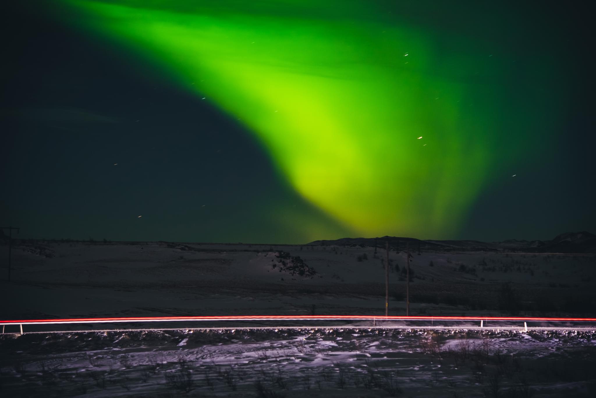 The Aurora Borealis with passing traffic